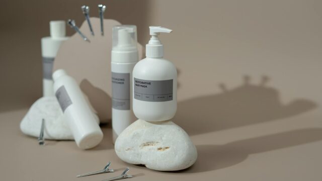 photo of a hair mask bottle on a rock