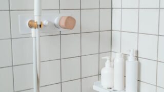 white tiled shower room
