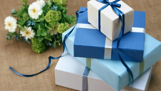 stacked blue colored gift boxes