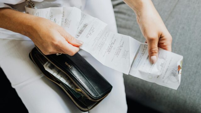 a person holding a wallet