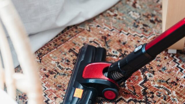 a vacuum cleaner on carpet