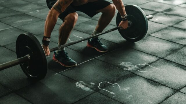 man about to lift barbell
