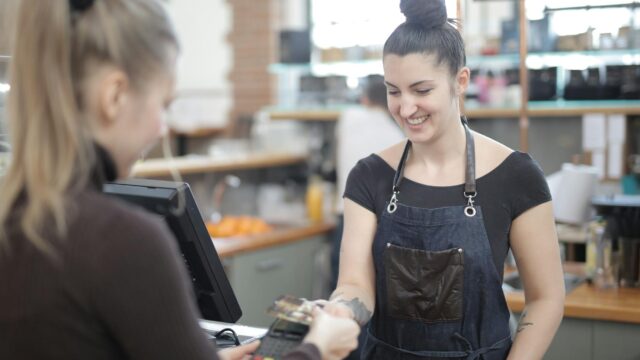 woman paying with credit card